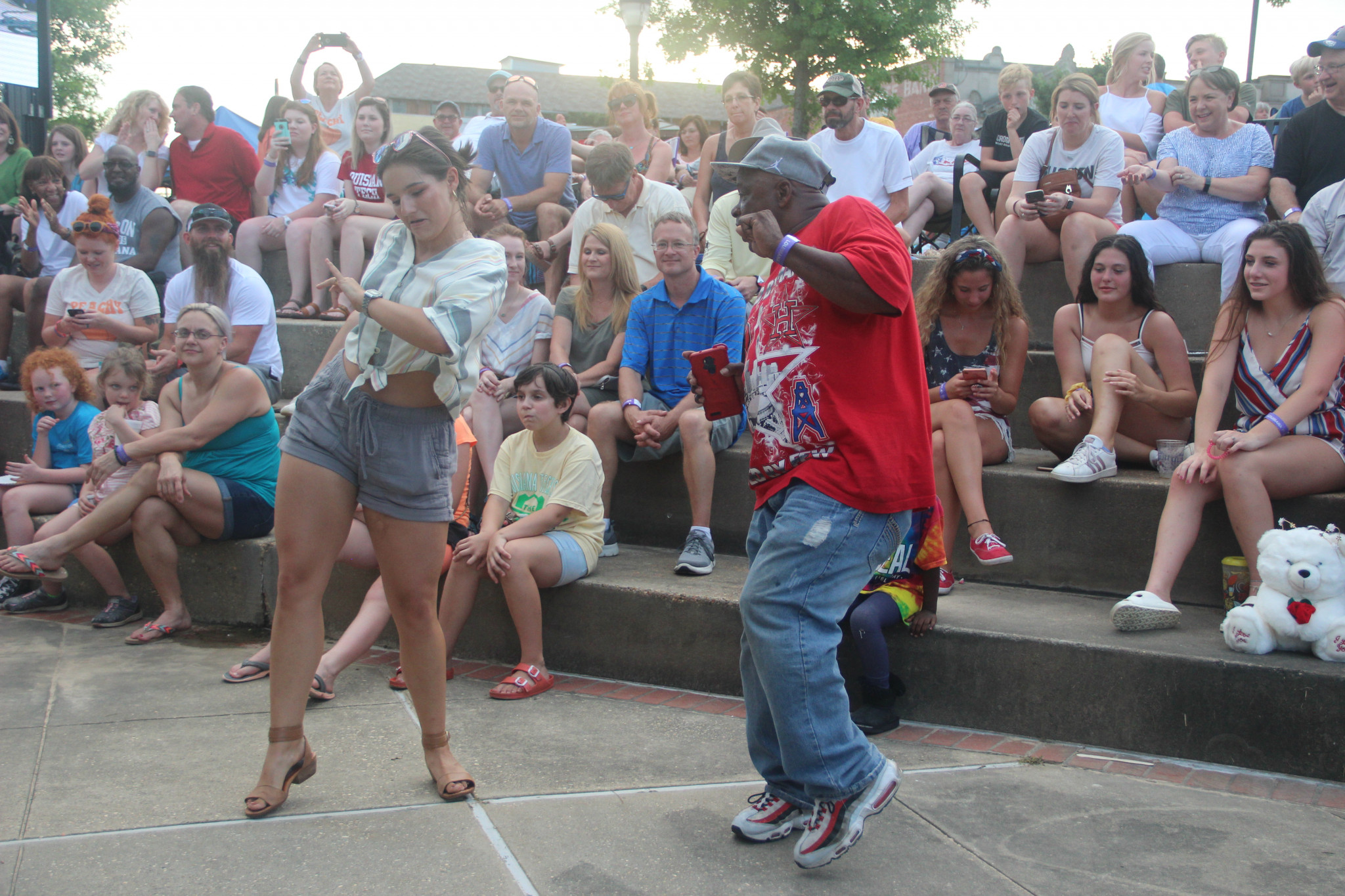 Concertgoers dancing during J.A.M.'s performance