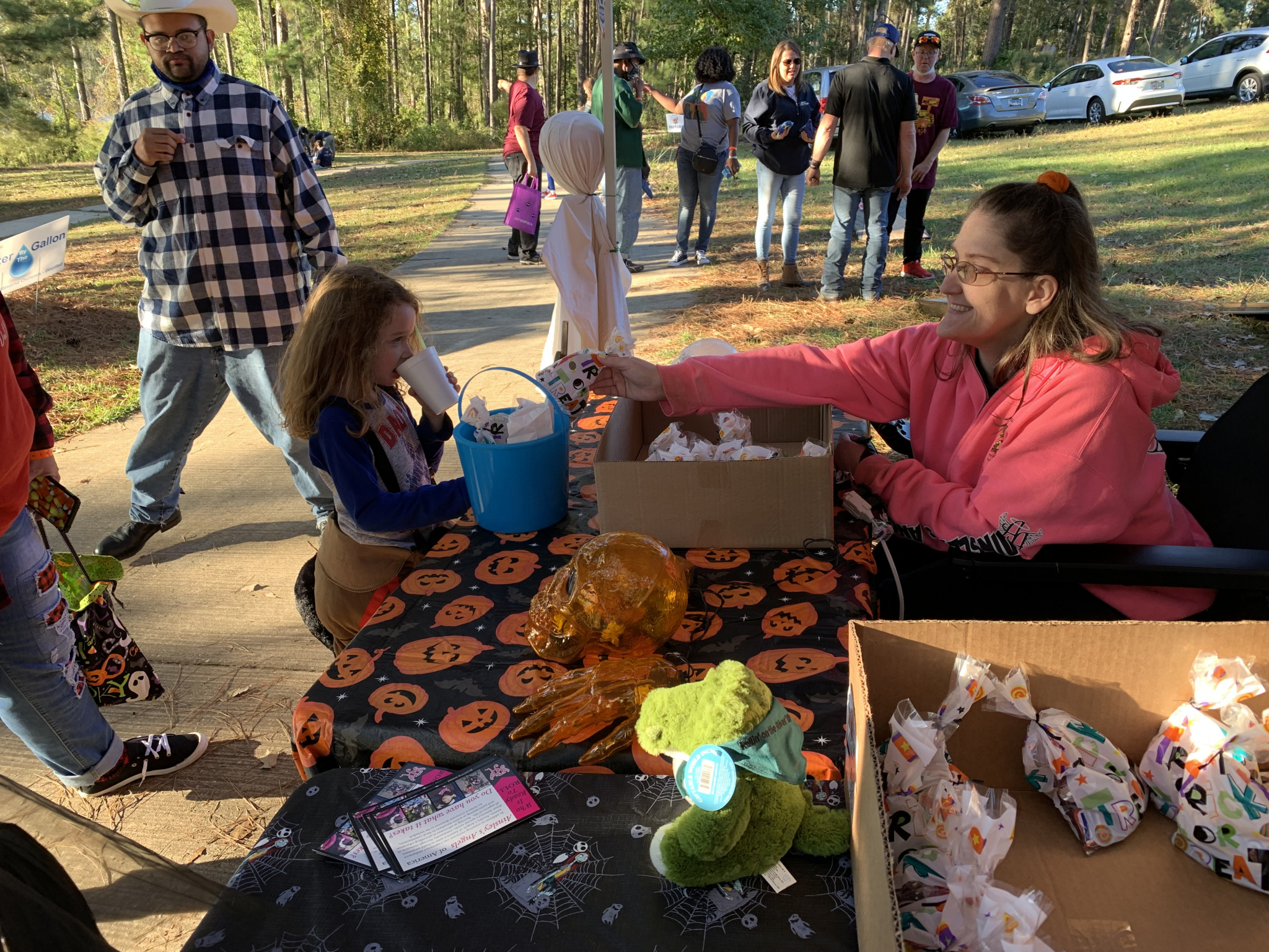 Corbin DeSoto, 5-year-old son of Josh and Lacey DeSoto of Columbia, gets candy from Emily Reed of Ansley’s Angels of Northeast Louisiana.